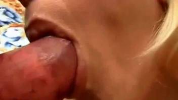 Attractive blonde hottie performing oral on a canine's impressive penis