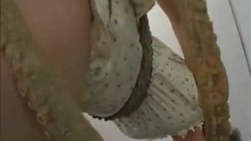 Tentacle monster ravishes a short-haired hottie on camera