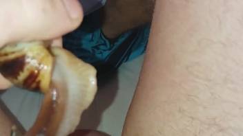 Guy allows a pair of snails to stimulate his moist cock