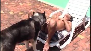 Muscular gay stud enjoying time with a naughty canine in high-definition