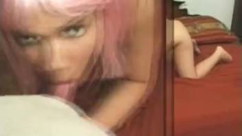 Pink-haired babe fellates her mastiff's rigid erection in a close-up shot