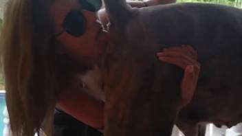 Sunglasses-clad babe adores a canine's succulent dick