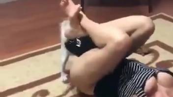 Voluptuous blonde bombshell keeps her fluffy small companion nestled between her thighs