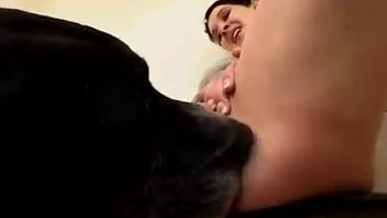 Disciplined ebony Doberman and two eager young women who devour cocks